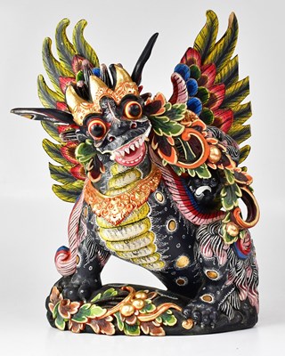 Lot 644 - A Balinese carved wooden painted dragon figure,...