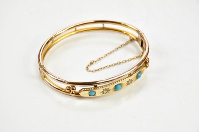 Lot 429 - A 9ct gold turquoise and diamond chip oval...