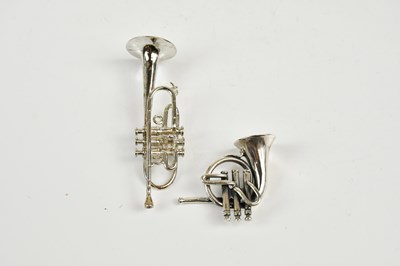 Lot 2496 - A sterling silver trumpet and a French Horn,...