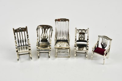 Lot 2462 - A collection of sterling silver miniature...
