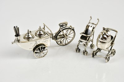 Lot 2463 - A sterling silver pram and a sterling silver...