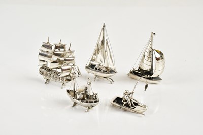 Lot 2464 - A group of five sterling silver boats...
