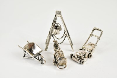 Lot 2493 - A collection of sterling miniature items...