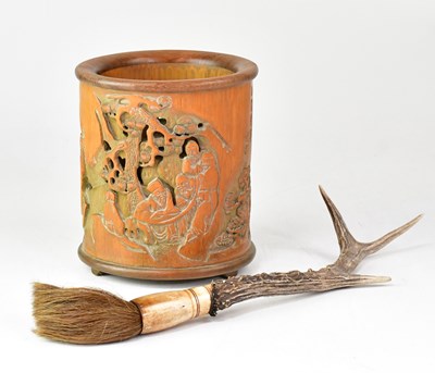 Lot 649 - An early 20th century carved bamboo brush pot...