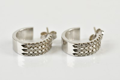 Lot 319 - A pair of 18ct white gold diamond set three...