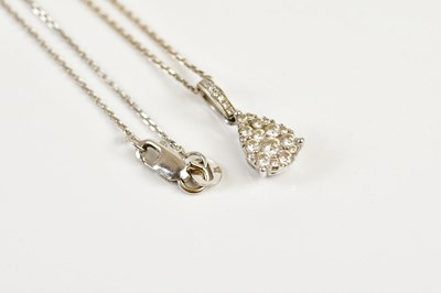 Lot 251 - An 18ct white gold diamond set pendant on fine...