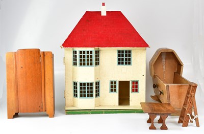 Lot 873 - A vintage dolls' house with tin front fascia...