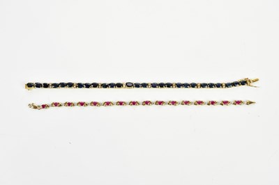 Lot 432 - A 10ct yellow gold synthetic ruby and diamond...