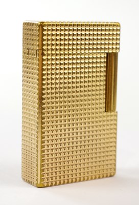 Lot 835 - DUPONT; a textured gold plated lighter of...