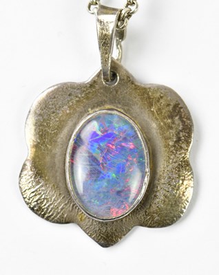 Lot 1155 - A white metal mounted doublet opal pendant...