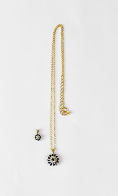 Lot 1201 - Two 9ct gold pendants set with sapphires and...