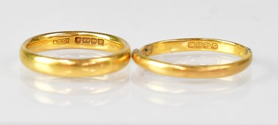 Lot 1062 - Two 22ct wedding bands, both size M, combined...