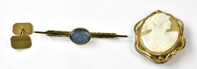 Lot 1146 - A yellow metal bar brooch set with a doublet...
