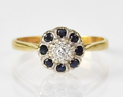 Lot 1072 - An 18ct gold ring with central illusion set...