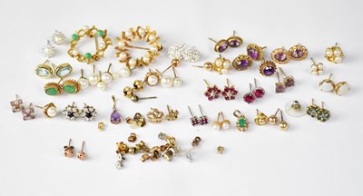 Lot 1251 - A group of costume jewellery, mostly earrings,...