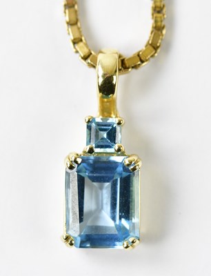 Lot 1124 - A yellow metal aquamarine pendant stamped 14K,...