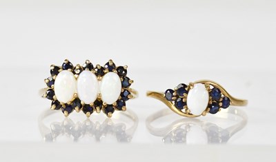 Lot 1117 - Two 9ct gold rings, one set with three oval...