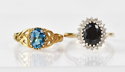 Lot 1114 - Two 9ct gold rings, one set with single blue...
