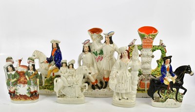 Lot 2843 - A collection of seven Staffordshire figures...