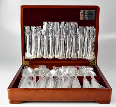 Lot 875 - ONEIDA; a six-setting set of stainless steel...