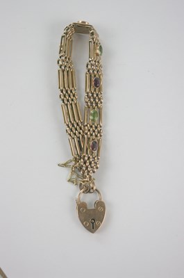 Lot 433 - A 9ct rose gold gate link bracelet set with...
