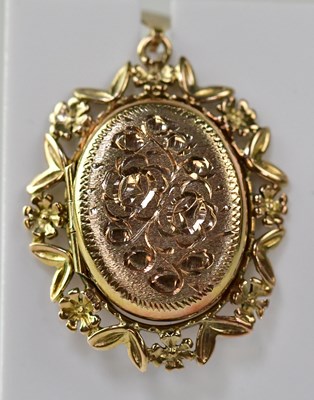 Lot 1191 - A 9ct gold double locket with floral chased...