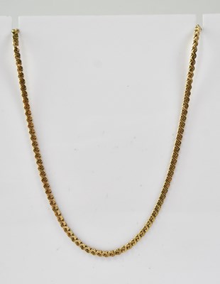 Lot 1220 - A 9ct gold flat link chain with hoop clasp,...