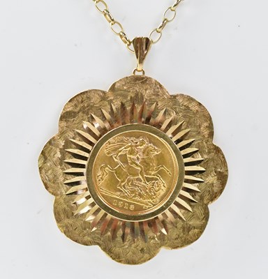 Lot 1186 - A George V half sovereign 1913, in a 9ct gold...