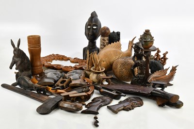 Lot 2744 - A collection of hardwood carved figures and...