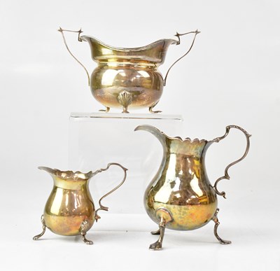 Lot 935 - A George III silver milk jug with scroll...