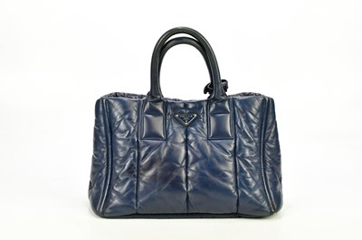 Lot 726 - PRADA; a blue quilted nappa leather...