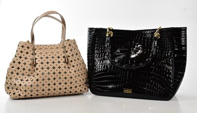 Lot 772 - RUSSELL & BROMLEY; an unused black patent...