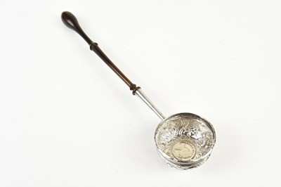 Lot 2390 - A Georgian white metal toddy ladle with turned...