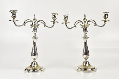 Lot 2034 - CHRISTOFLE; a pair of silver plated twin...
