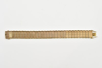 Lot 408 - A 9ct yellow gold panel bracelet with engraved...