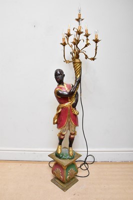 Lot 1513 - A modern painted and gilt wood blackamoor...