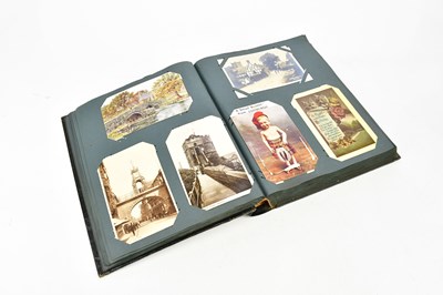 Lot 1834 - An early 20th century postcard album,...