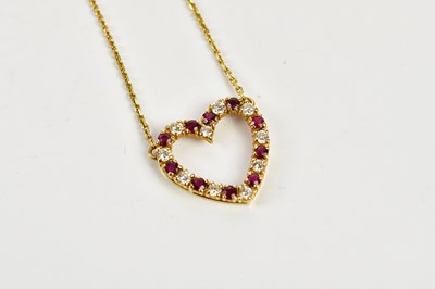 Lot 276 - A yellow metal fine link chain supporting a...