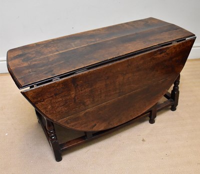 Lot 1146 - A 17th century oak drop-leaf gateleg dining...