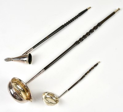 Lot 2366 - A Georgian hallmarked silver toddy ladle with...