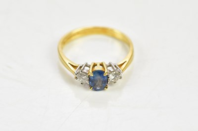 Lot 1386 - An 18ct yellow gold diamond and sapphire ring,...