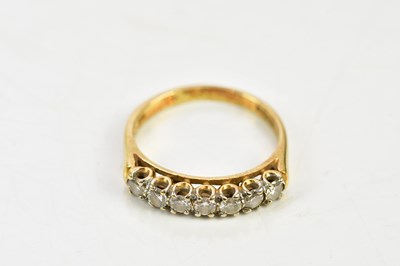 Lot 1461 - An 18ct yellow gold seven stone diamond half...