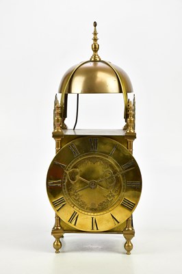 Lot 1322 - A brass cased lantern clock with twin fusee...