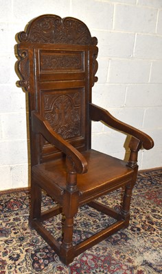 Lot 1568 - A 17th century style carved oak wainscot chair