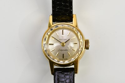 Lot 584 - OMEGA; a lady's gold plated steel back...