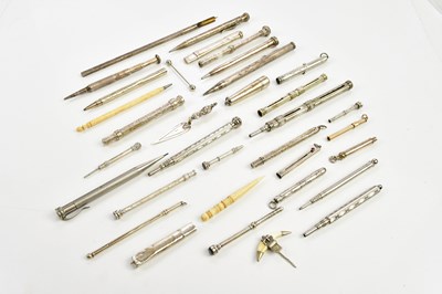 Lot 1415 - A 9ct yellow gold toothpick with engine turned...