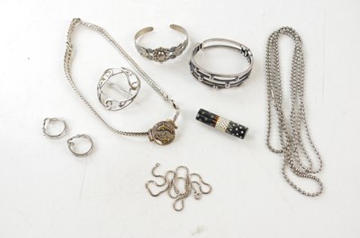 Lot 860 - A silver heavy link chain with dolphin pendant,...