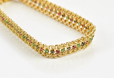 Lot 401 - A 14ct yellow gold bracelet with central band...