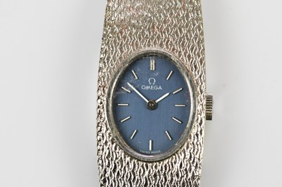 Lot 566 - OMEGA; a 1973 9ct white gold lady's wristwatch...