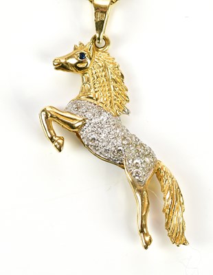 Lot 247 - A 9ct yellow gold diamond and sapphire set...